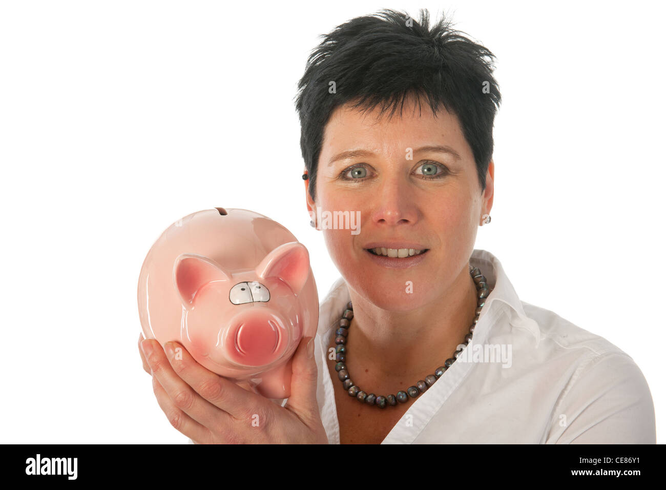 Young woman is holding a big piggy bank Stock Photo - Alamy