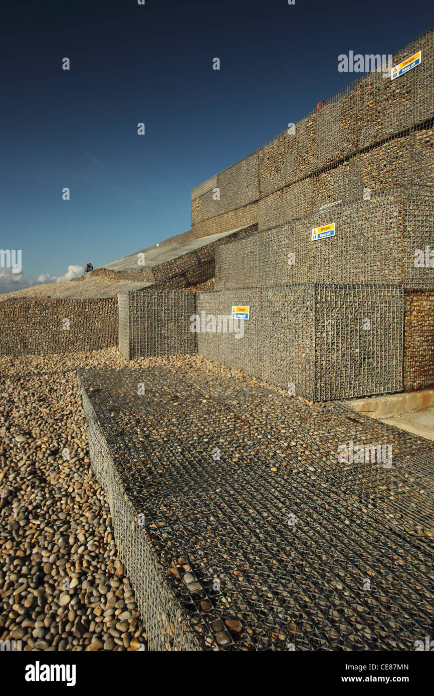 Metal gabion, Chesil beach Dorset UK, sea defences. Stock Photo