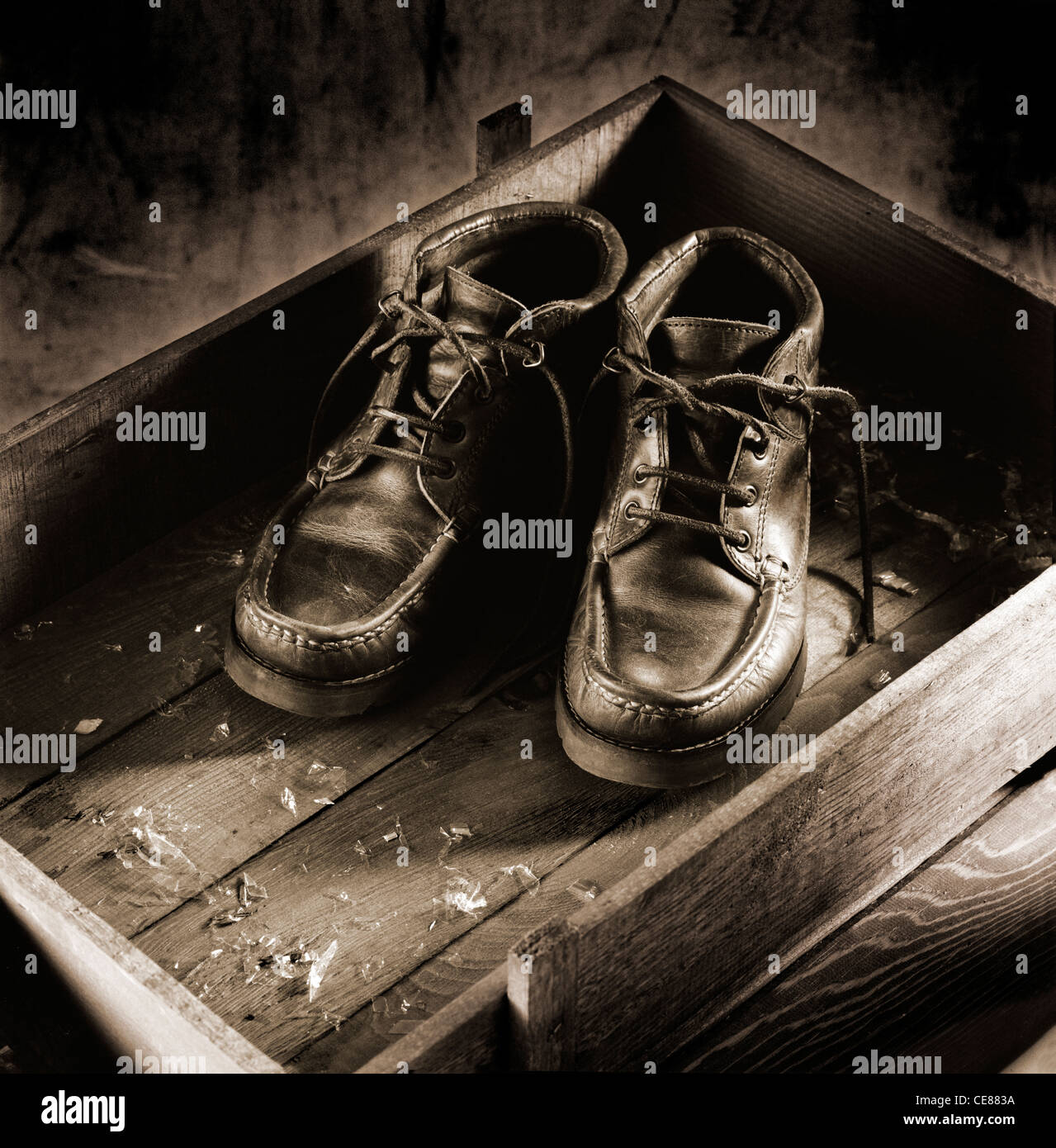 Pair of boots in a box of wood Stock Photo