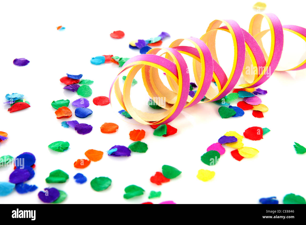 Colorful confetti and party streamer over white background Stock Photo Alamy