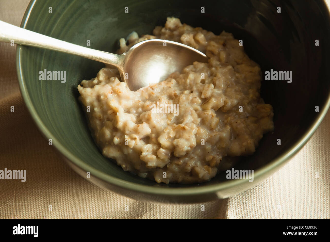 A serving of porridge in a bowl. Stock Photo