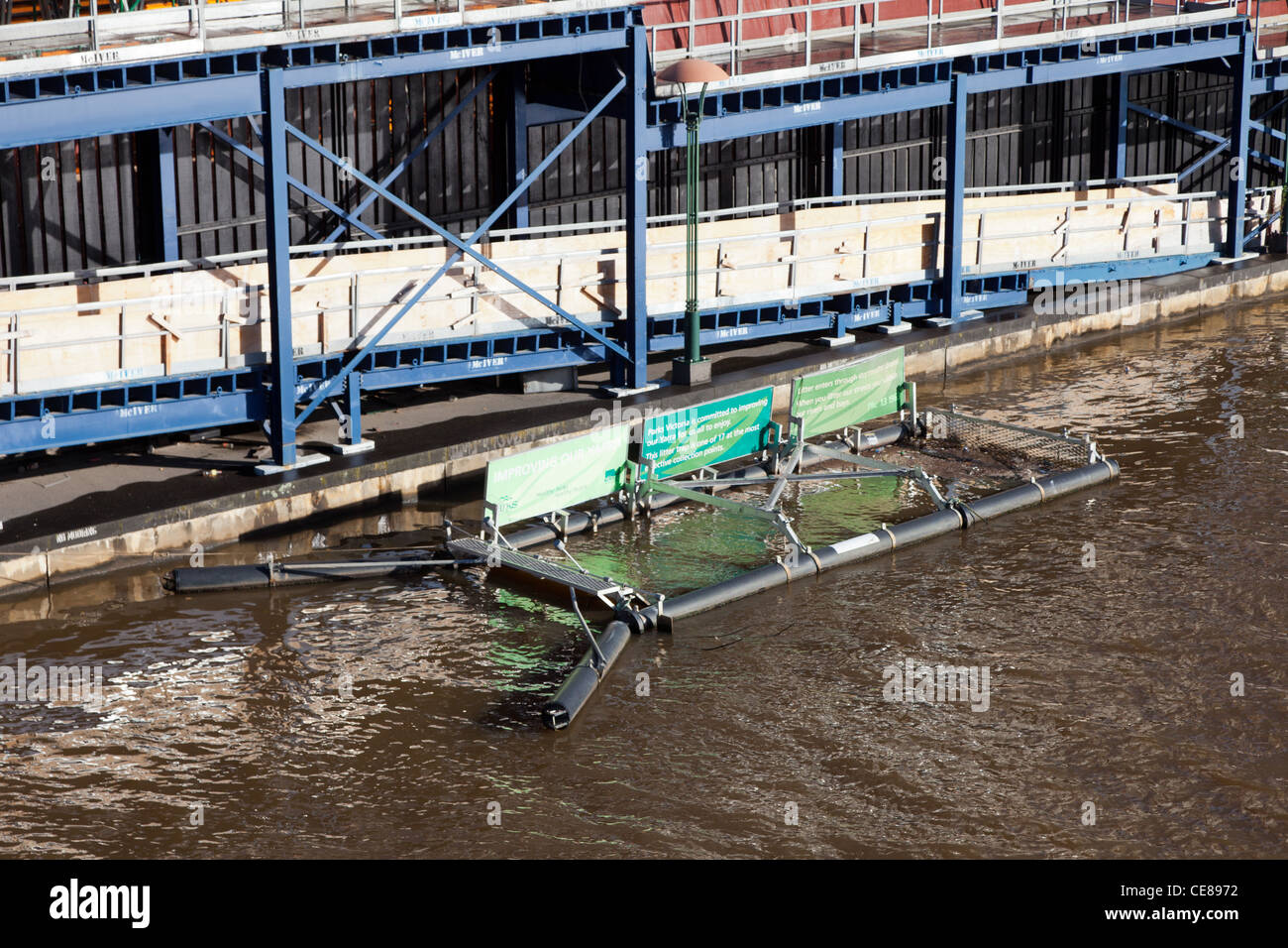 Floating trash collector on the yarra river in the centre of stock