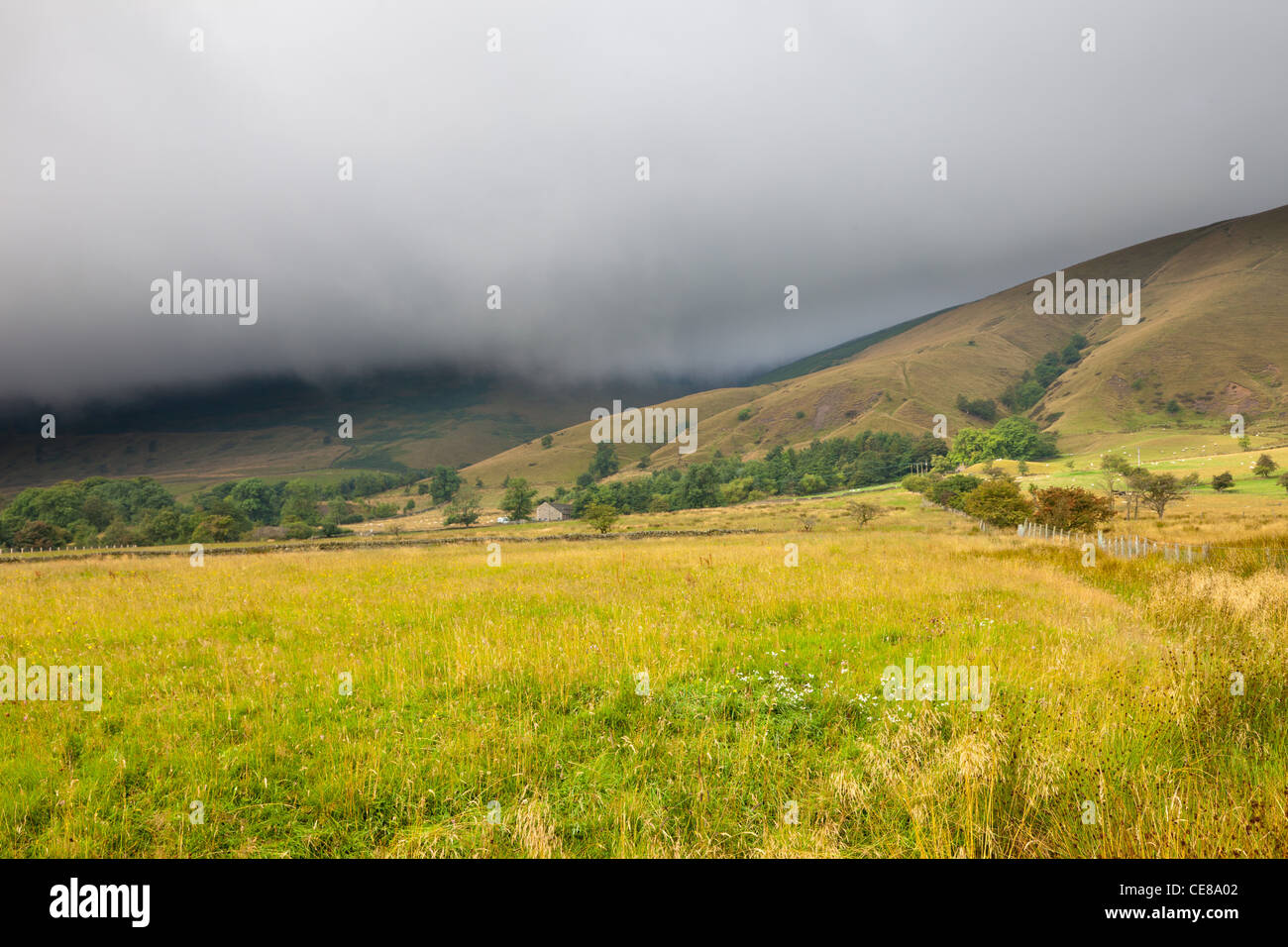Rain clouds over Peak District landscape Derbyshire Stock Photo