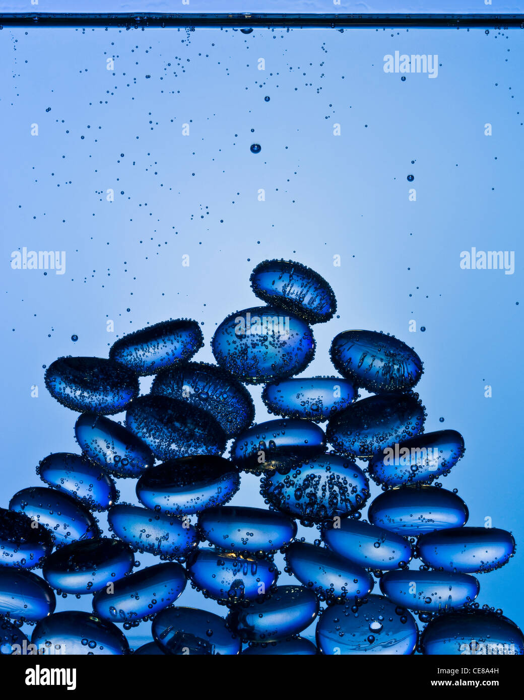 Blue glass pebbles underwater shot with professional medium format digital leaf back. Stock Photo
