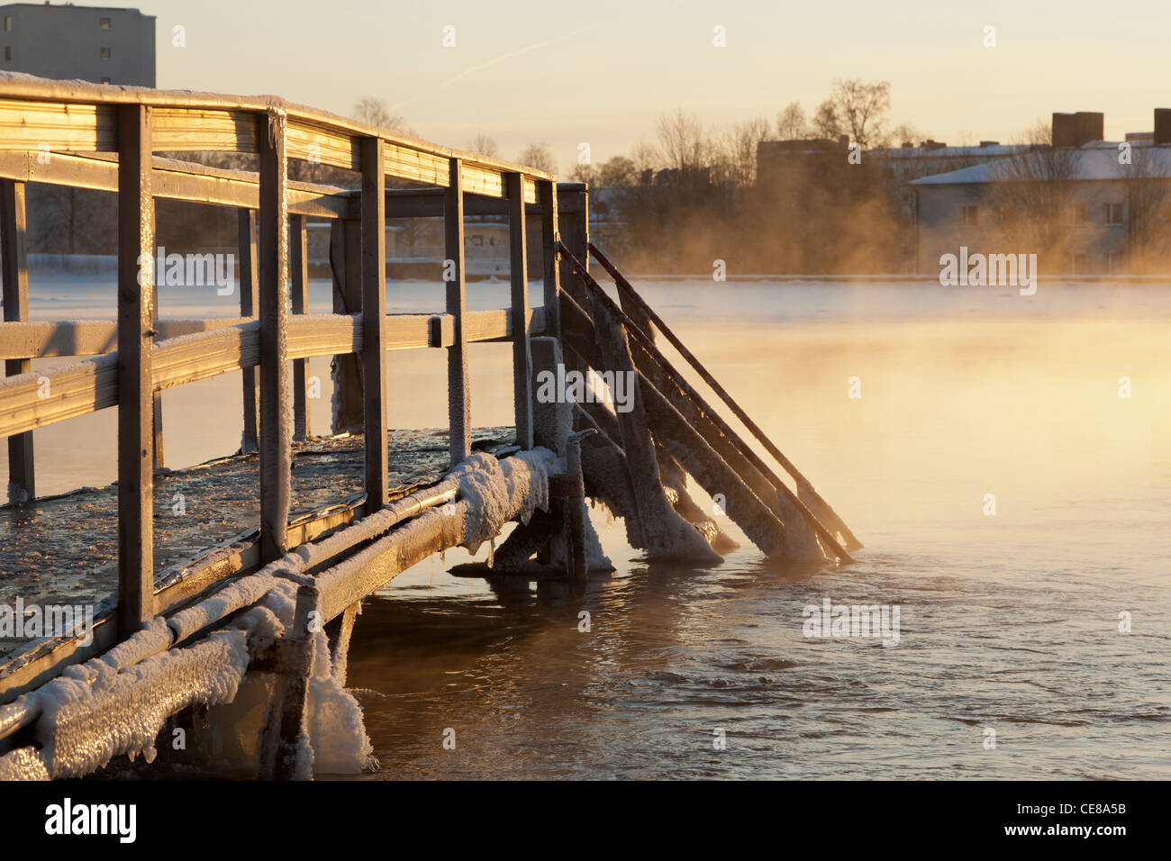 The winter swimming dock in wintertime when sun is shining and weather is about -20 degrees Celsius by the river Oulujoki Stock Photo