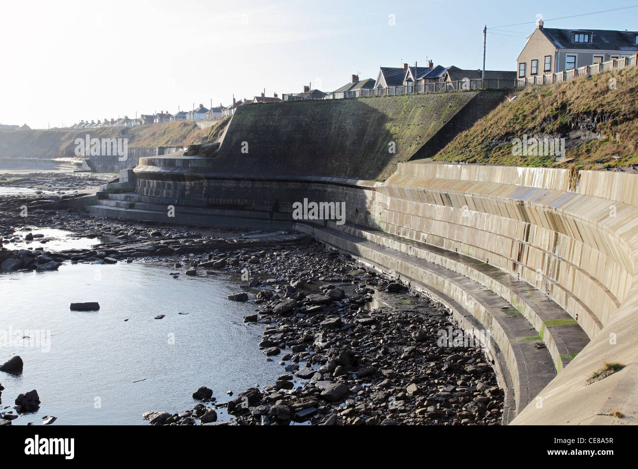 North Sea defence wall at Collywell Bay, Seaton Sluice north east England UK Stock Photo