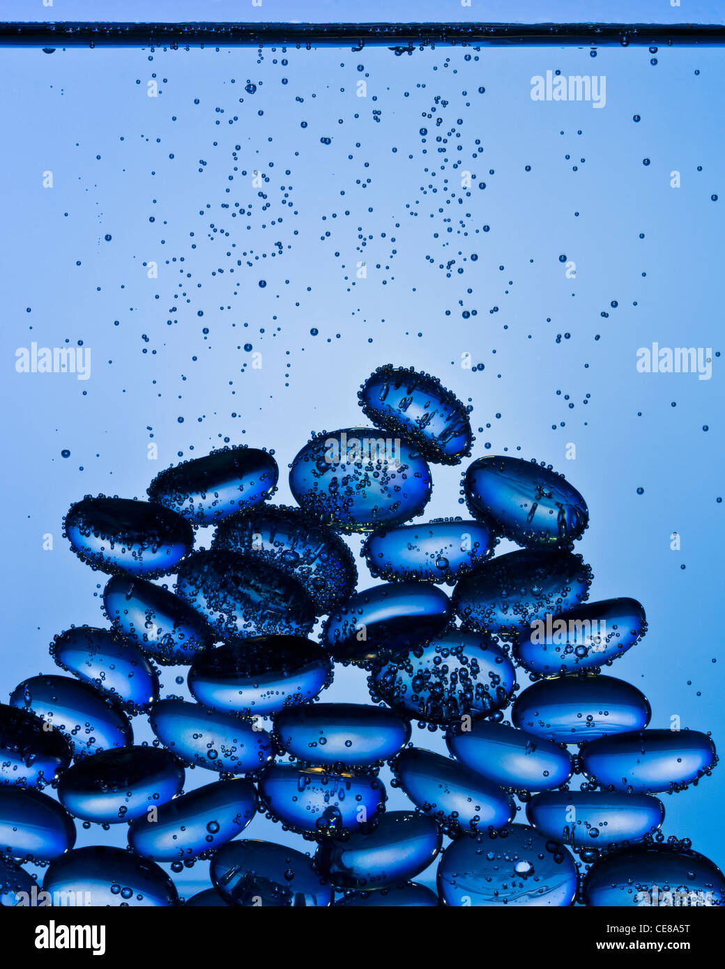 Blue glass pebbles underwater shot with professional medium format digital leaf back. Stock Photo