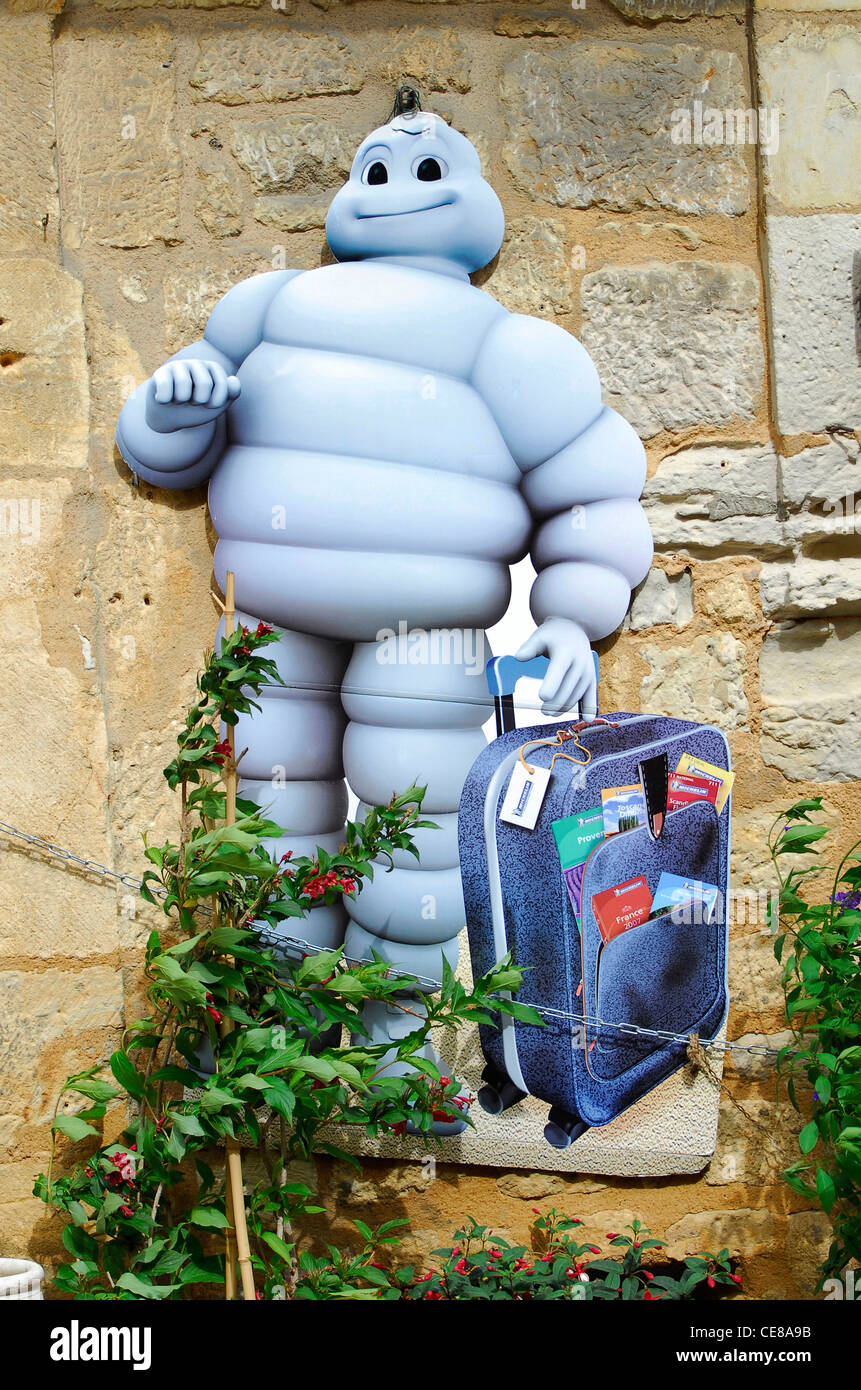 michelin man and suitcase, dordogne, france Stock Photo