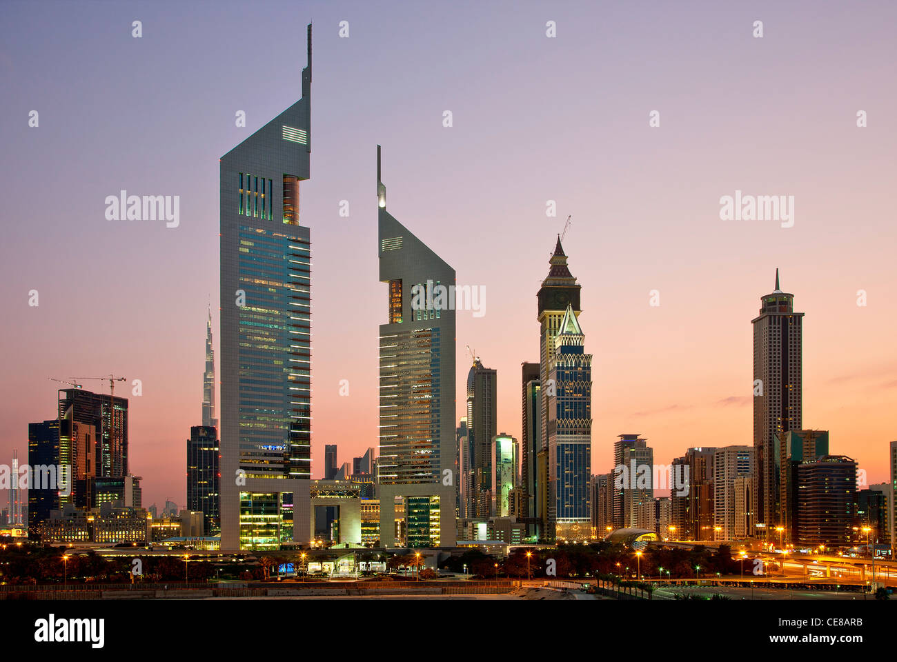 Dubai, Emirates Towers and Skyscrapers at Dusk Stock Photo