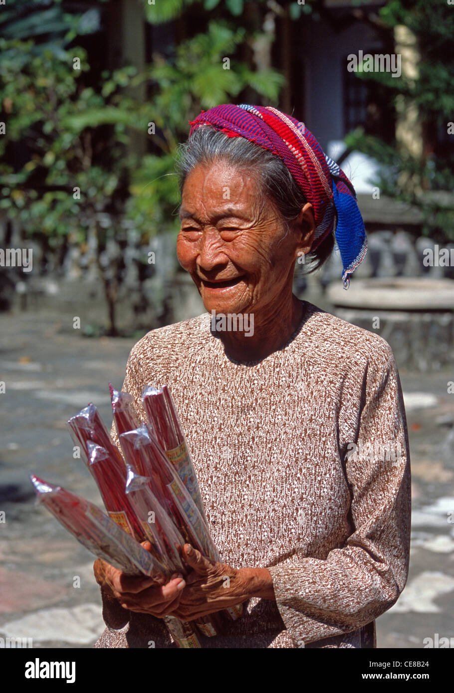 Woman joss sticks hi-res stock photography and images - Alamy