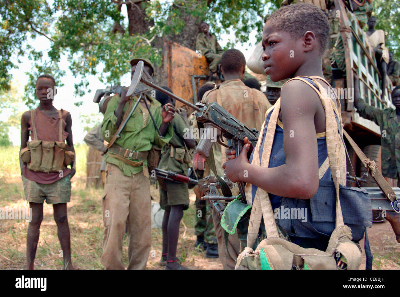 Sudanese child soldiers in the Sudan People's Liberation army, Southern Sudan pictured during a break in fighting with Northern Sudanese government forces near Yei Stock Photo