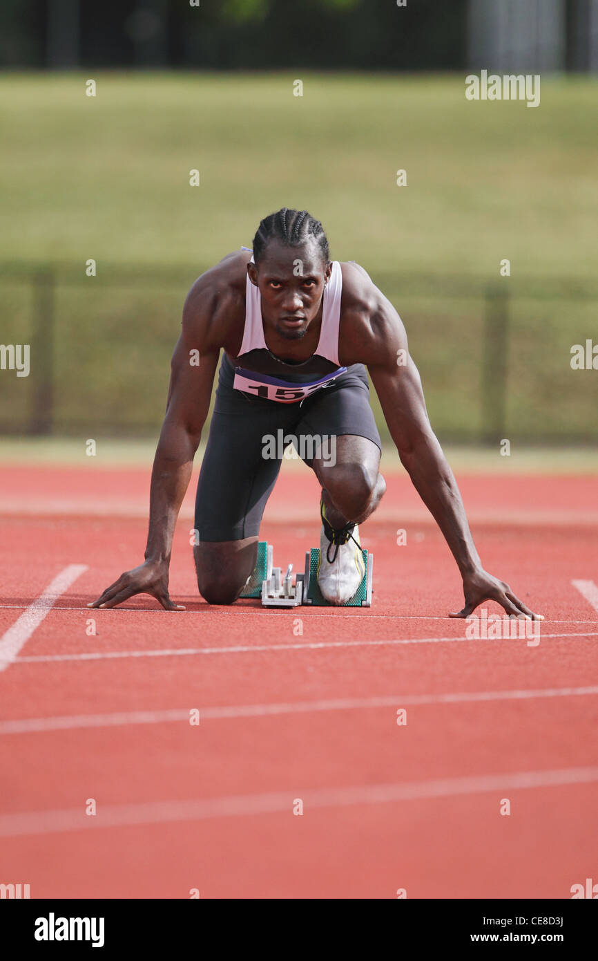 Runner at Starting Block Stock Photo Alamy