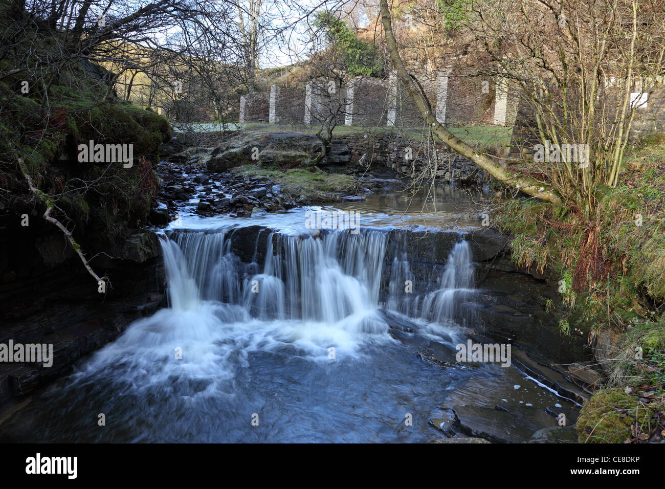 Waterfall on Middlehope Burn With the Bouseteems of Slit Mine Behind Slit Wood Westgate in Weardale County Durham UK Stock Photo