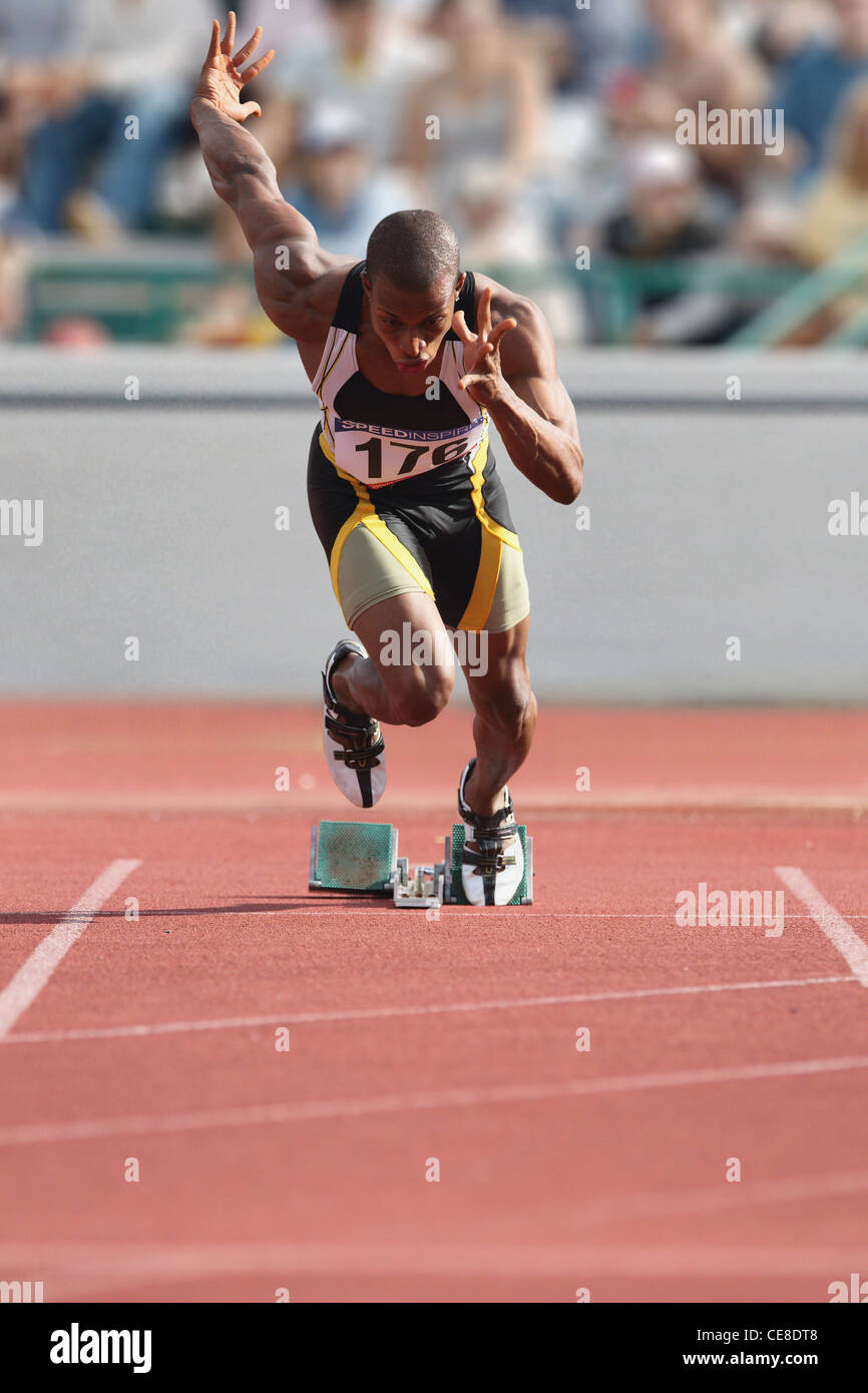 Athlete Sprinting From Starting Blocks Stock Photo Alamy