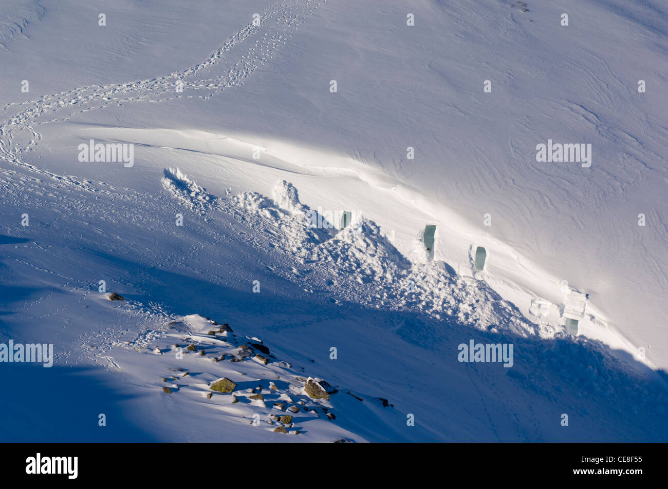 Snowholes made by mountaineers in a snowdrift on the Cairngorm plateau (Ben Macdui). Stock Photo