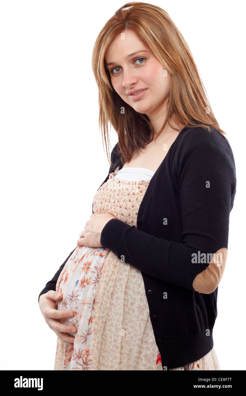 Young pregnant woman smiling and keeping her belly Stock Photo Alamy