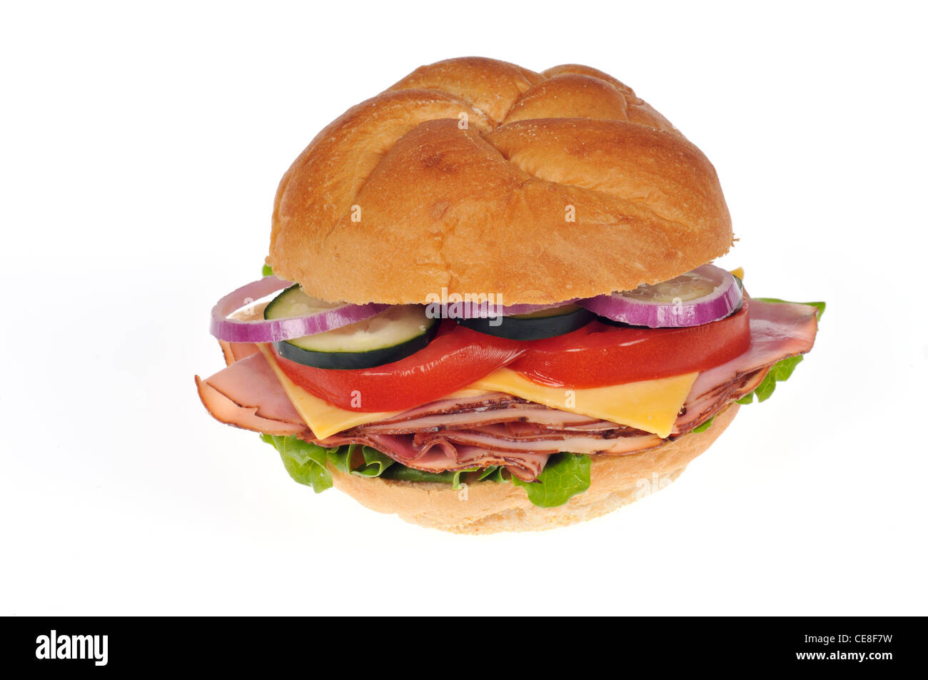 Ham and cheese  sandwich with lettuce, tomato and red onion on white bread bulkie roll on white background cutout USA Stock Photo