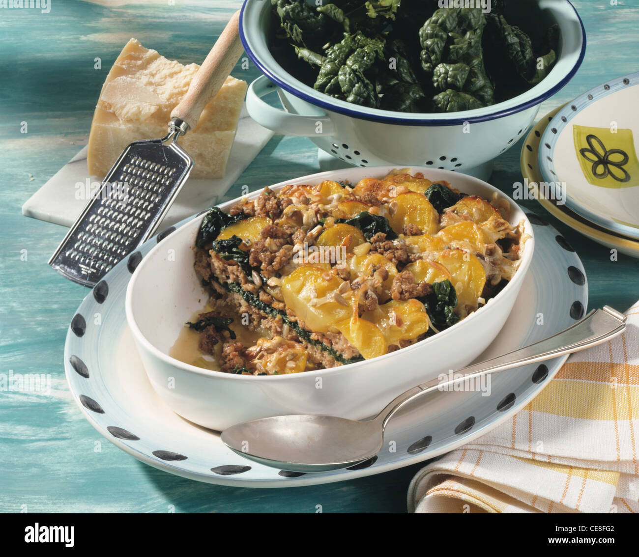 Potato minced meat au gratin with spinach leaves Stock Photo Alamy