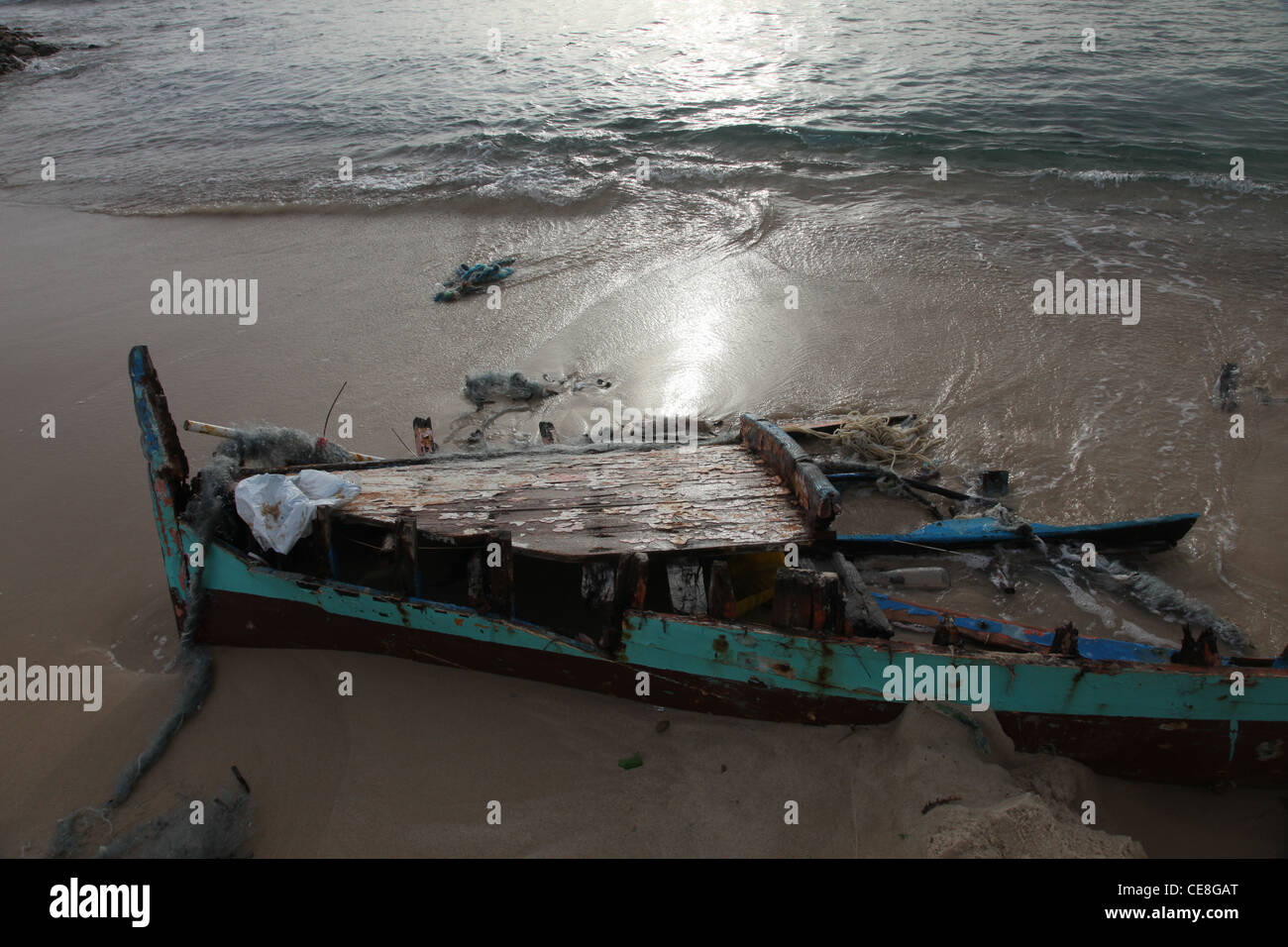 Damaged ship on the beach Stock Photo