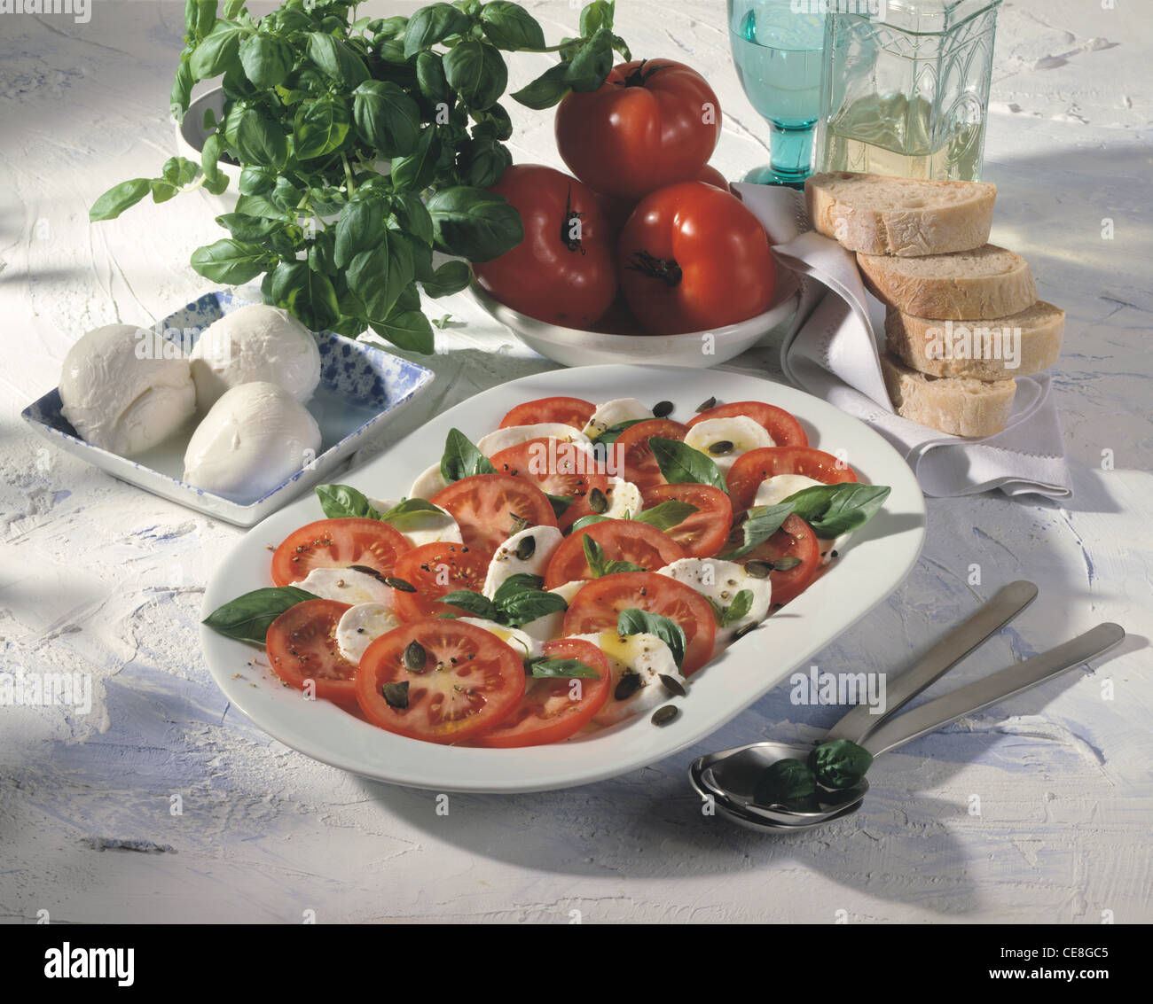 Insalata caprese - tomato with mozzarella cheese and basil Stock Photo ...