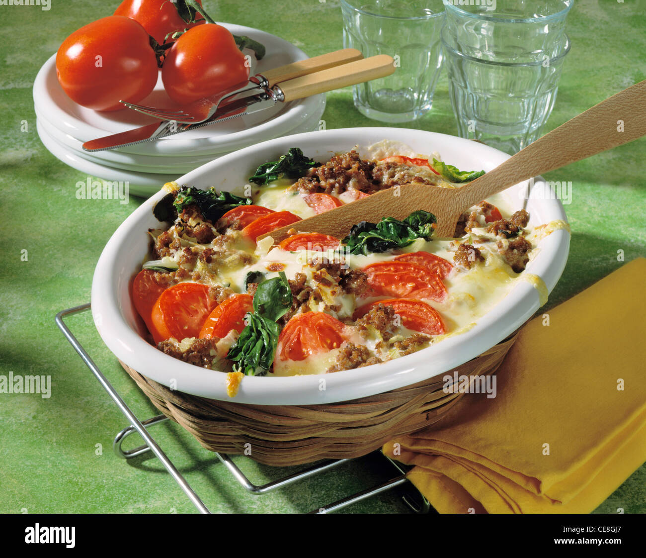 Minced meat tomato au gratin with spinach beet Stock Photo Alamy