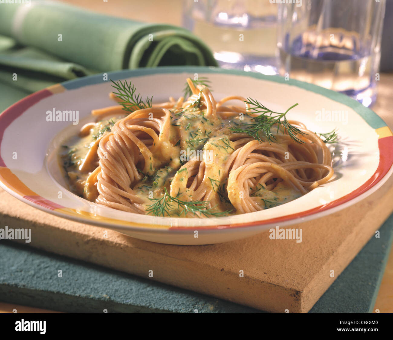 German wheat spaghetti in saffron dill sauce Stock Photo Alamy