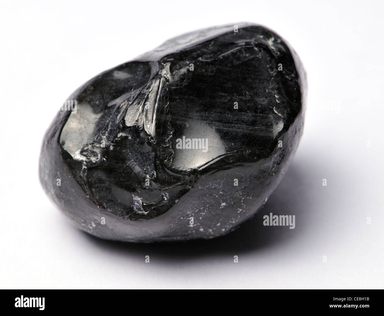 Obsidian - natural volcanic glass (from Mexico) 'Apache Tear' (tumble-polished nodule) Stock Photo
