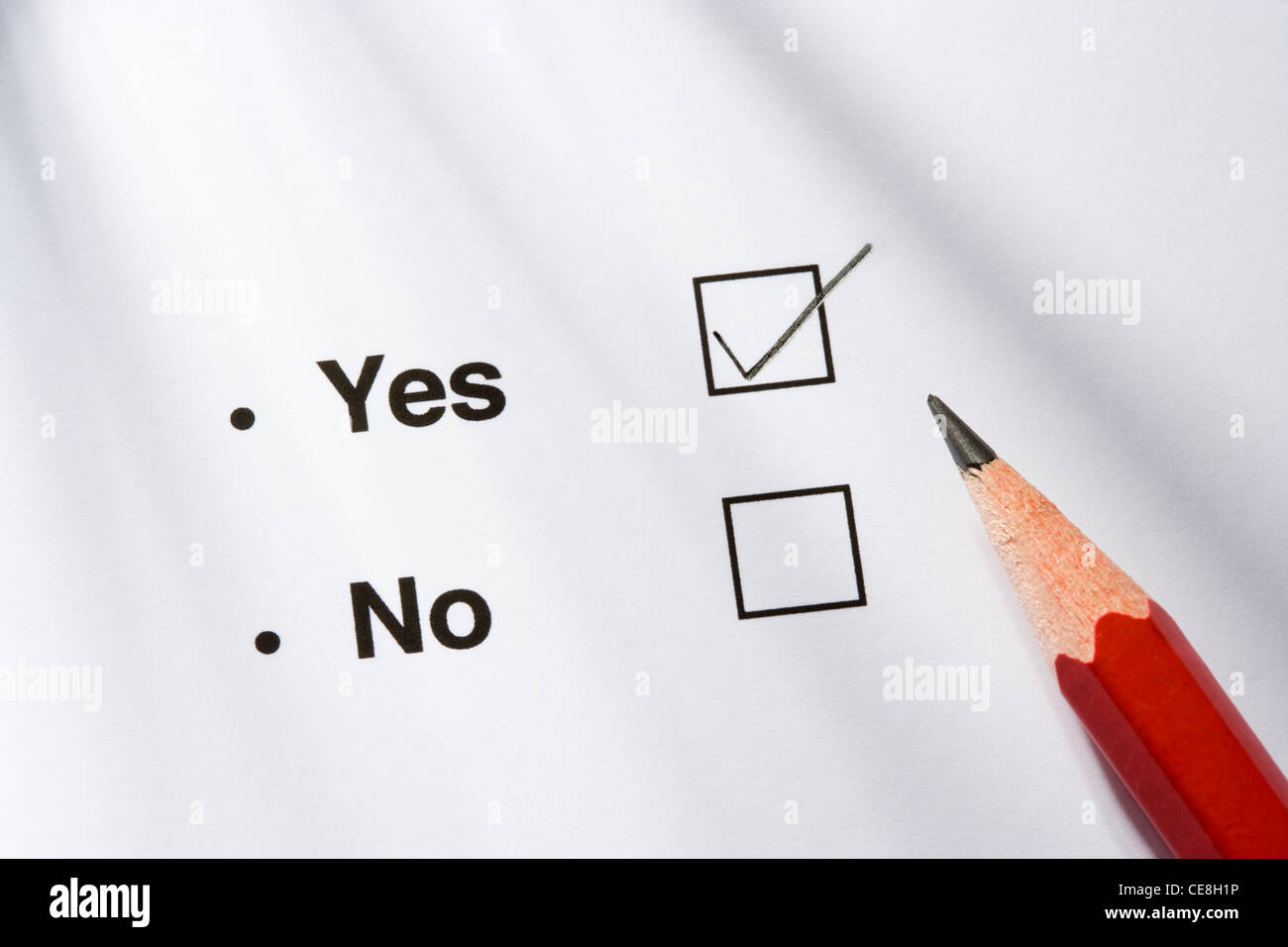 Yes/no option and pencil. Yes ticked. Stock Photo