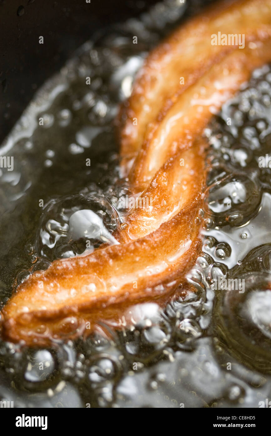 Deep frying churro Stock Photo Alamy