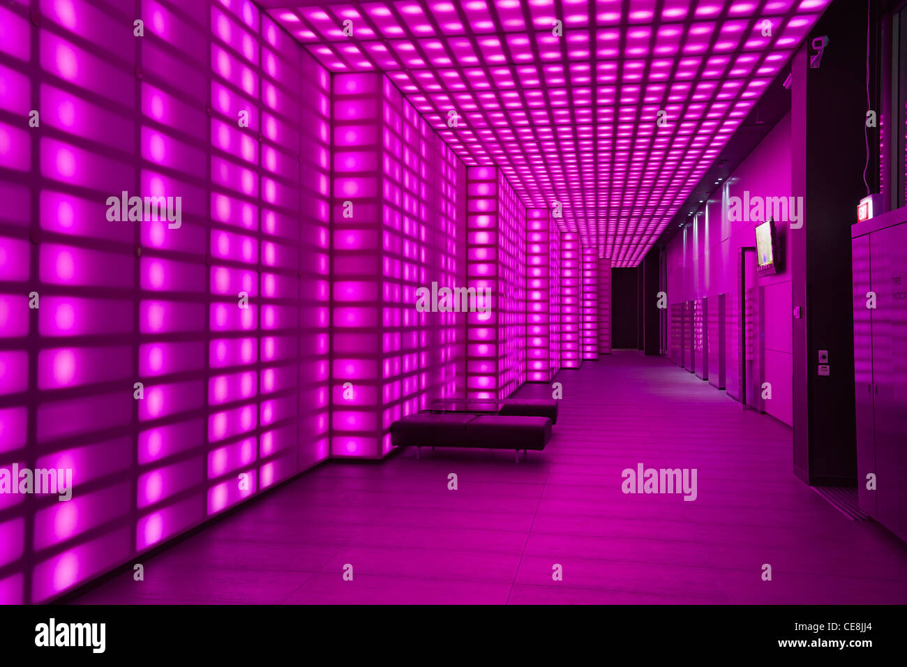 Pink lighting wall lobby / entrance room to night club or disco. Stock Photo