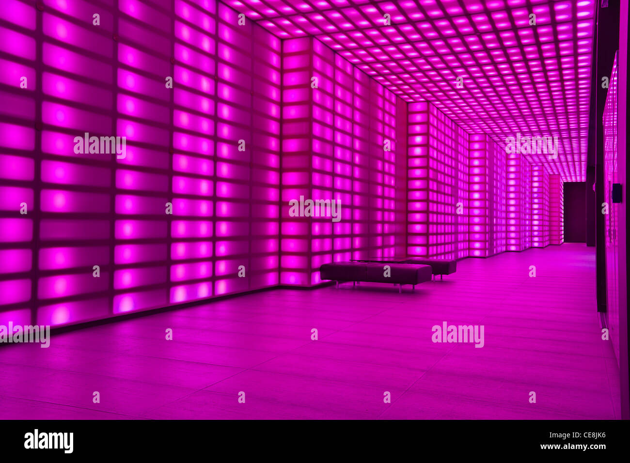 Pink lighting wall lobby / entrance room to night club or disco. Stock Photo