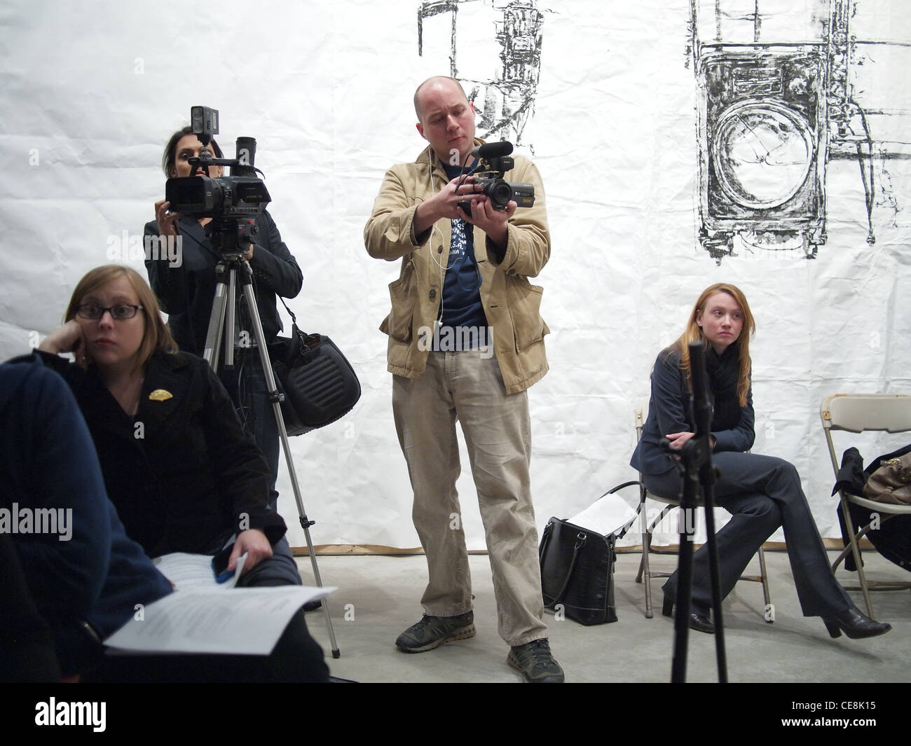 Videographer taping a political meeting, Brooklyn, New York Stock Photo