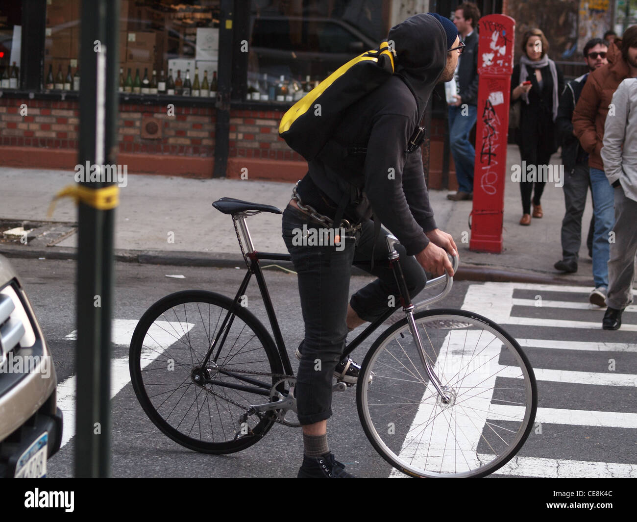 Hipster on fixed-gear bicycle, Brooklyn, New York Stock Photo