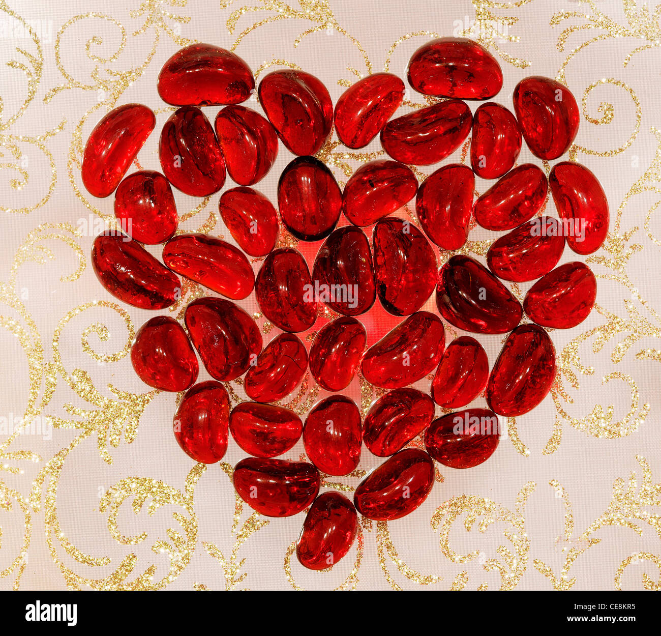Red heart on the gold ornament background Stock Photo - Alamy