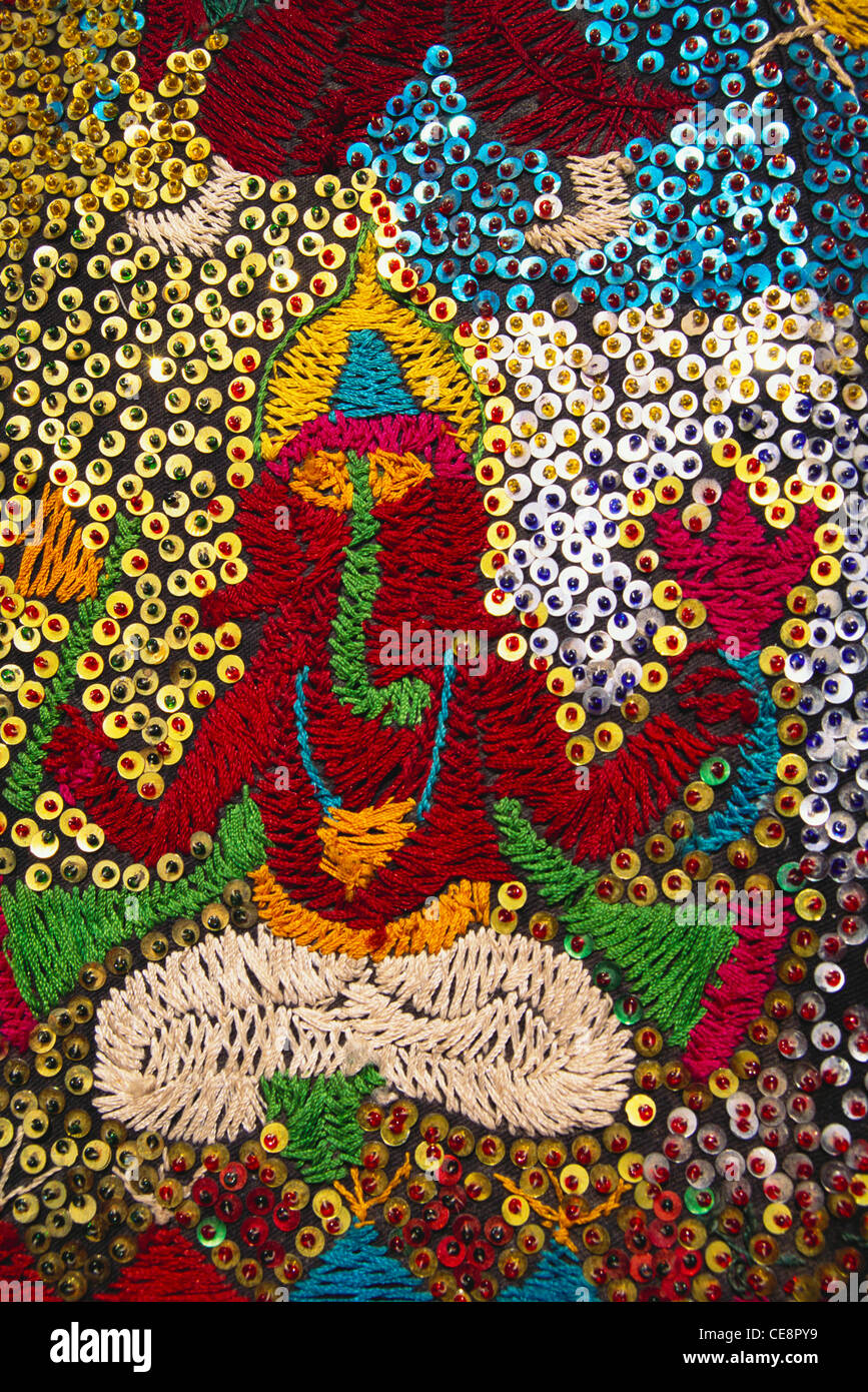 Intricate embroidery of Ganesh ganpati Elephant head Lord on umbrella chhatri Tarnetar fair surendranagar gujarat india Stock Photo