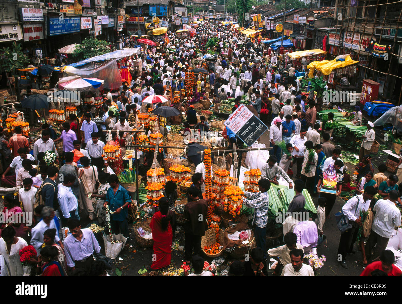 Flower shop crowd and row of hawkers on Ganesh Festival in Dadar market