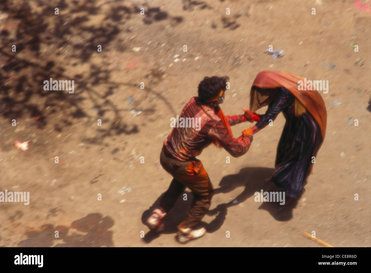 man molesting woman holi festival ; rang panchami ; hola moholu punjabi ; bombay mumbai ; maharashtra ; india Stock Photo