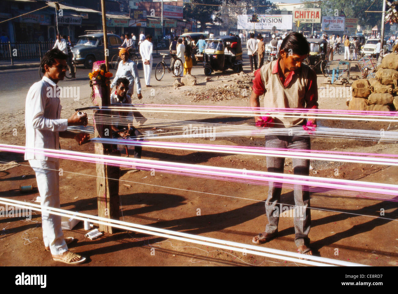 Man making kite flying thread gujrat india Stock Photo Alamy