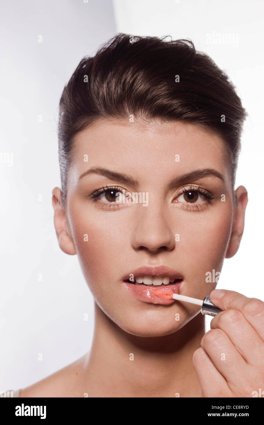 Lip gloss application Stock Photo Alamy