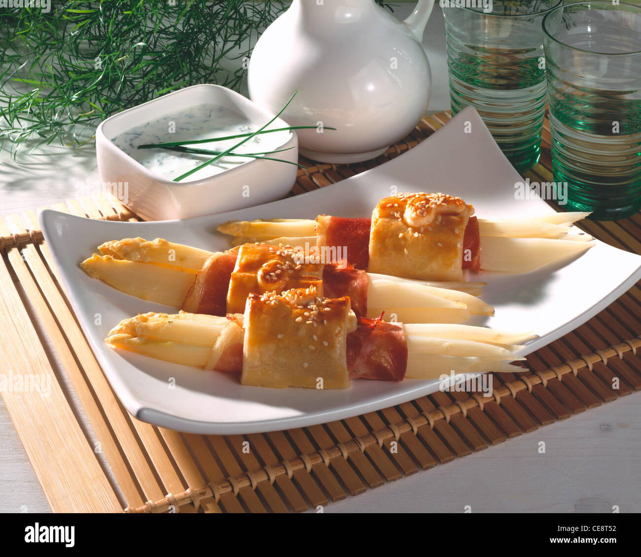 Asparagus bacon rolls in puff pastry with herb cream Stock Photo Alamy