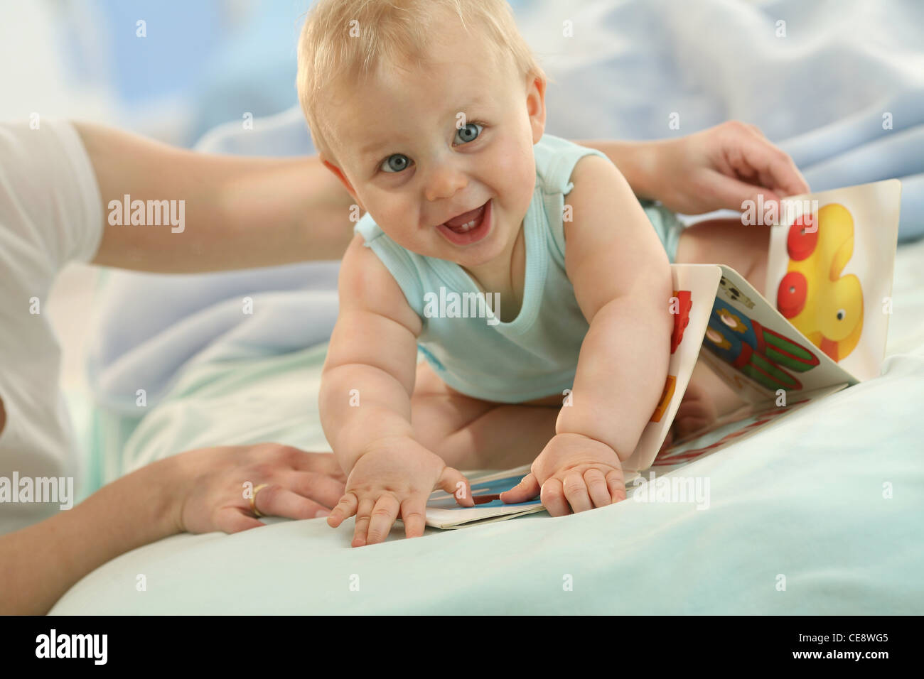 Mother and baby picture book Stock Photo Alamy