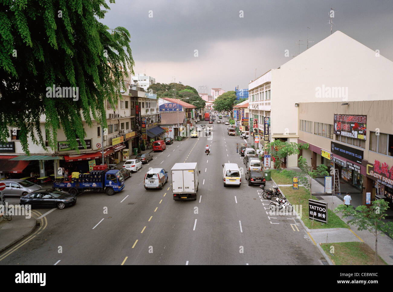 Street scene in the district of Geylang in Singapore in Far East Southeast Asia. Road Traffic Car Life Lifestyle Modern Travel Stock Photo