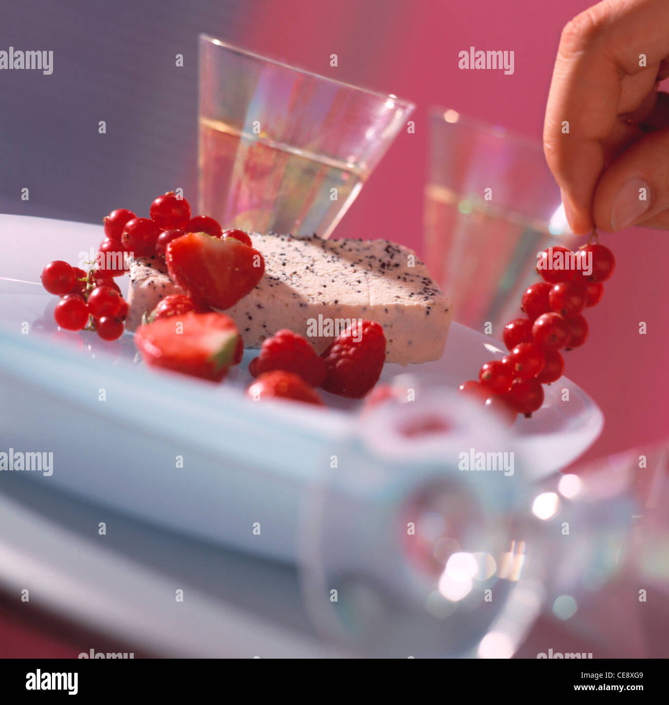 Poppy seed jelly with fresh berries Stock Photo Alamy