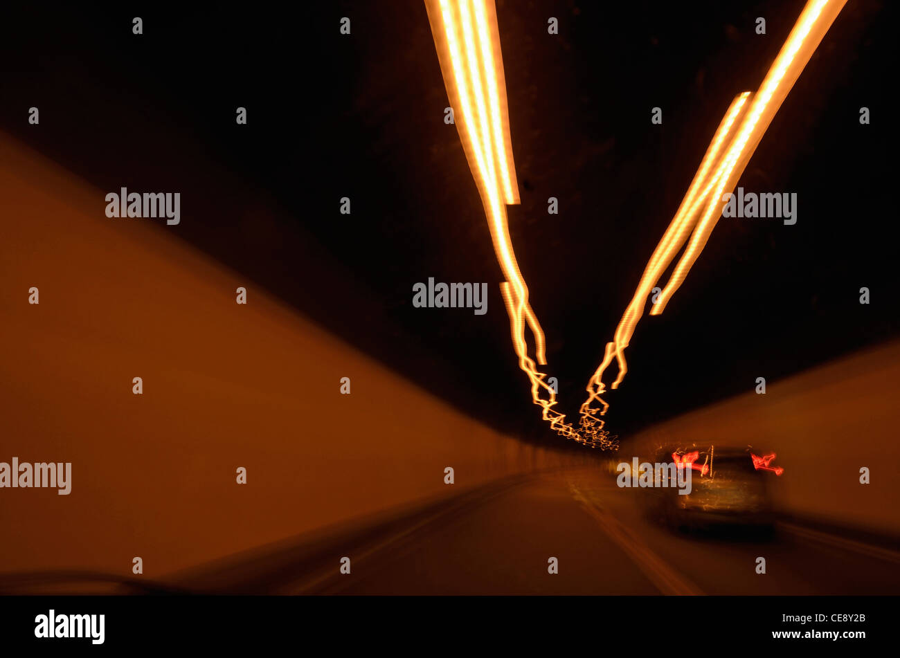 Speeding car inside a highway tunnel, Italy (blurred motion) Stock Photo