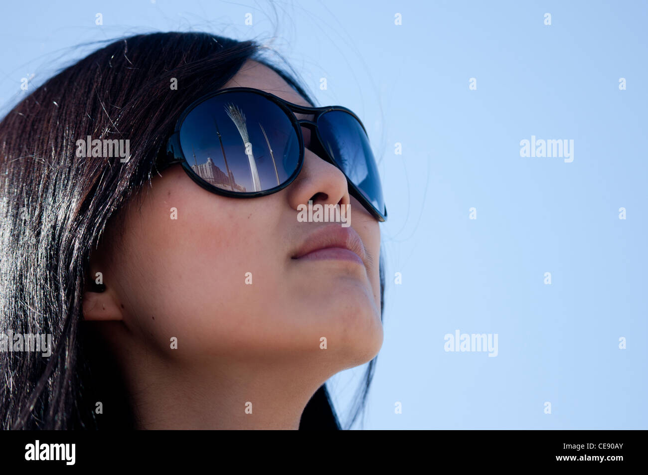 Cute ethnic kazakh girl with sunglasses. Stock Photo