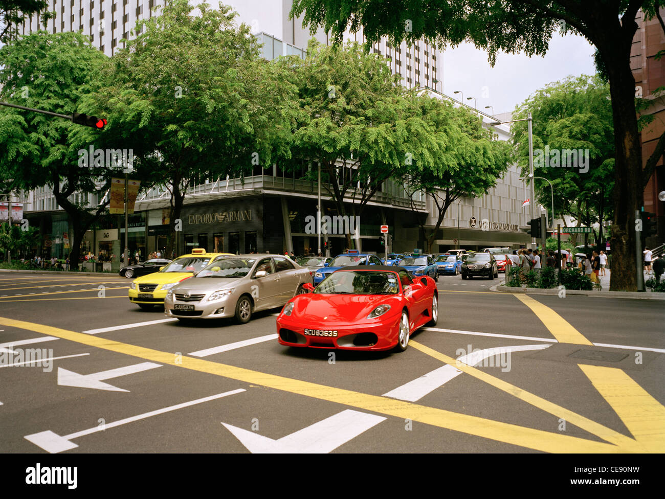 Street scene on the exclusive Orchard Road in Singapore in Far East Southeast Asia. Exclusive Rich Wealth Wealthy Life Car Modern Testarossa Stock Photo