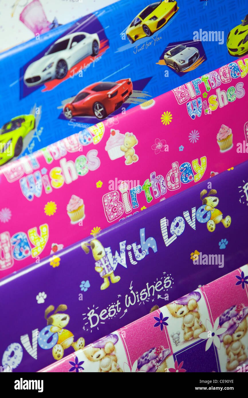 Gift wrapping paper on display for sale on a market stall Stock Photo