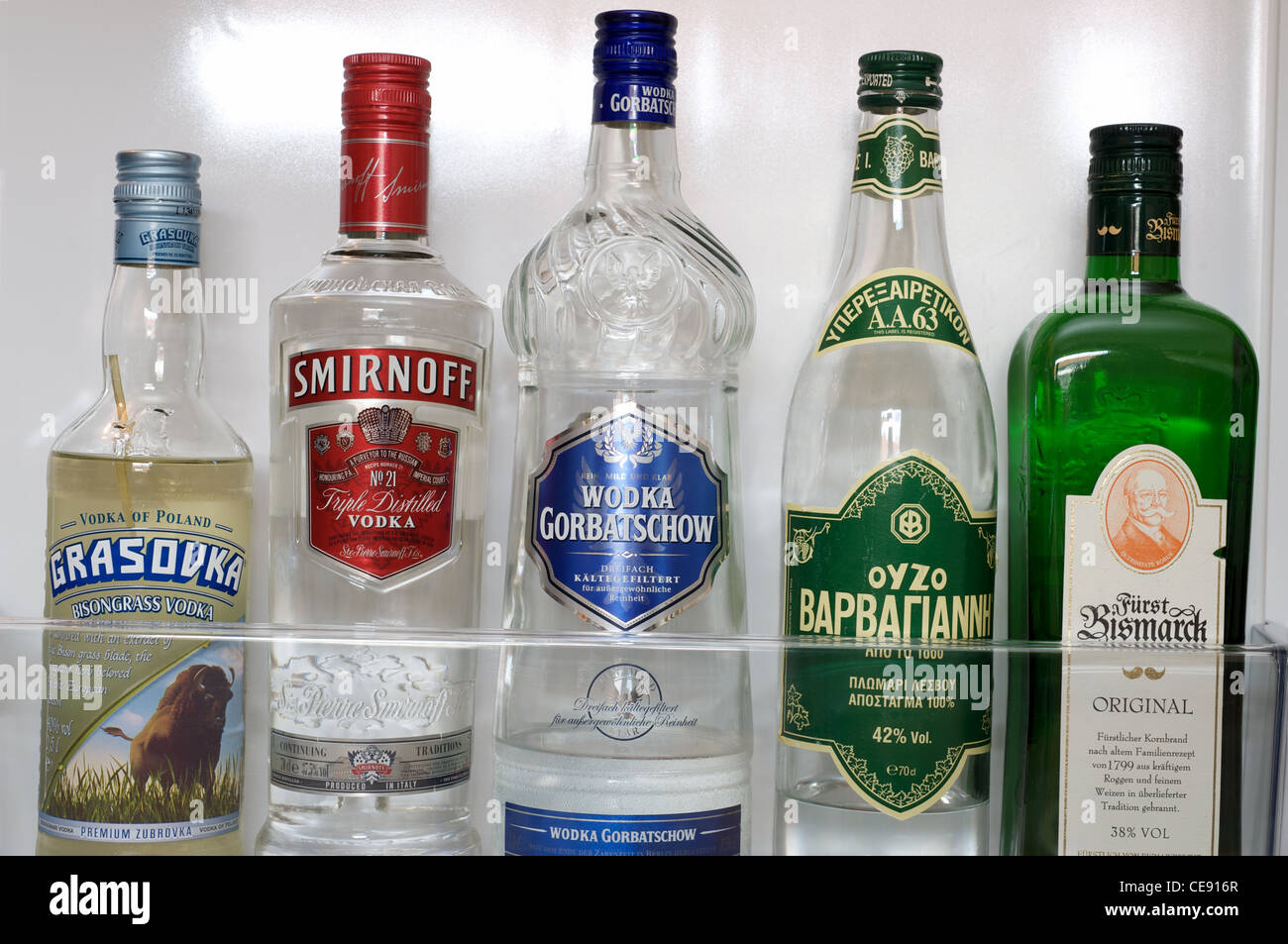 Bottles of alcohol in fridge Stock Photo
