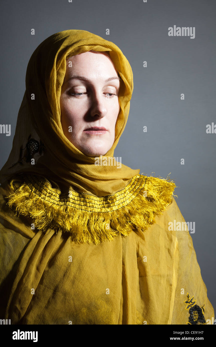 Woman wearing Yellow Shawl Stock Photo