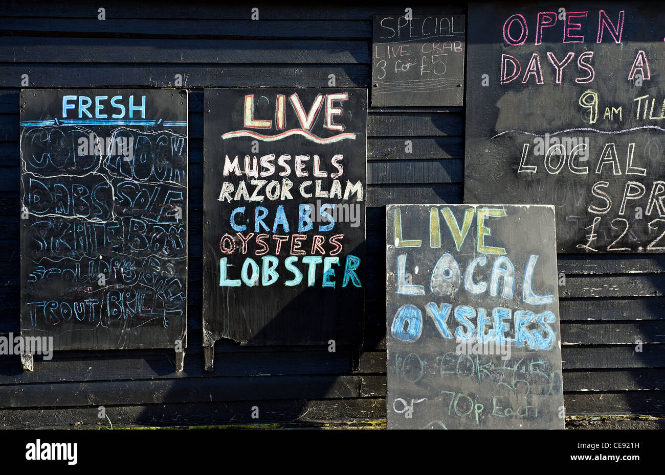 Signs advertising seafood for sale Stock Photo
